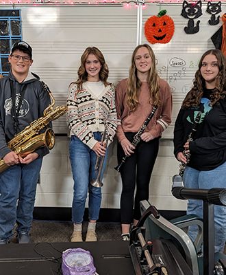  All-county band students pose with their instruments