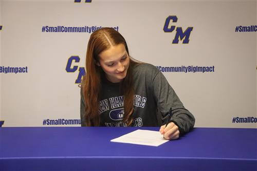 Amber Clarke signs letter